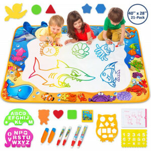 3 kids drawing on the magic mat