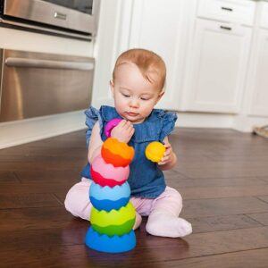 a toddler girl playing the Tobbles Neo