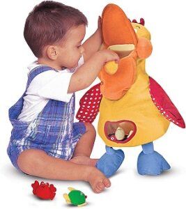 a toddler boy playing Melissa & Doug K’s Kids Hungry Pelican