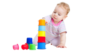 A toddler girl playing Stacking & Nesting Cups