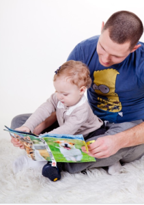 Father reading with a toddler