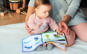 mom reading book with toddler