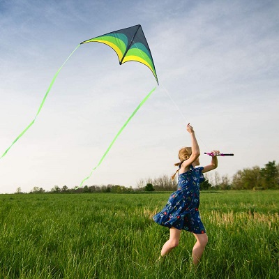 a girl flying a kite