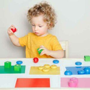 toddler boy play blocks